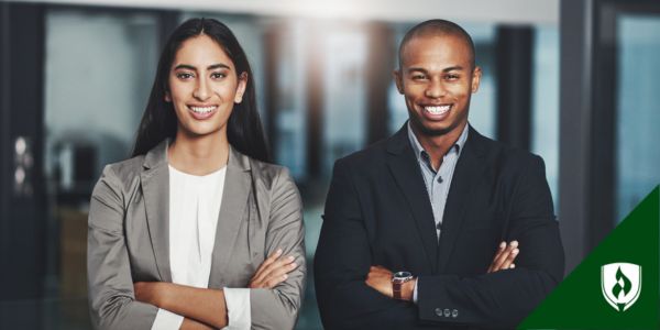 A budget analyst and financial analyst smile at the camera